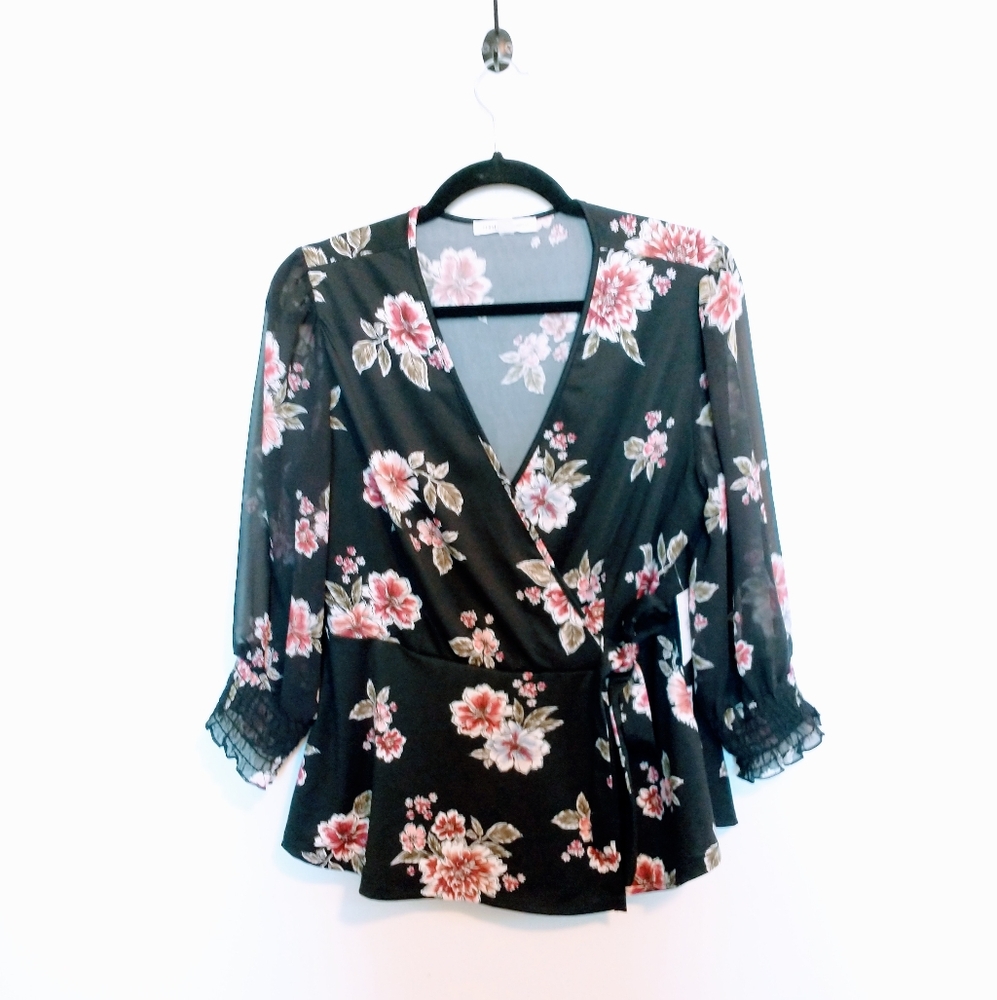 NWT Perseption Concept floral top with 3/4 sleeves. Black with a v neck size me